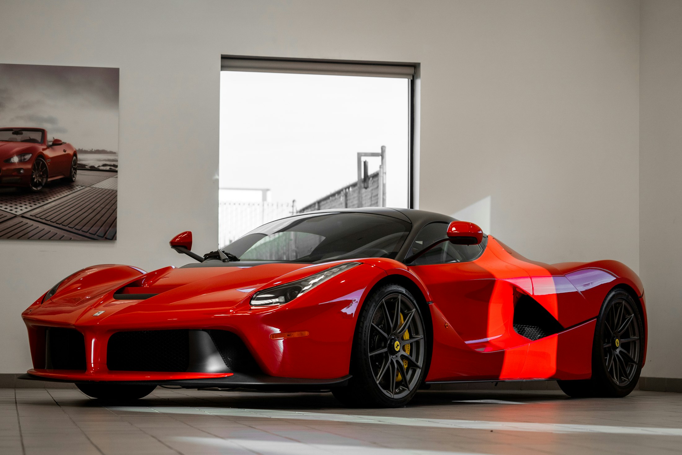 Red Ferrari LaFerrari in a white gallery