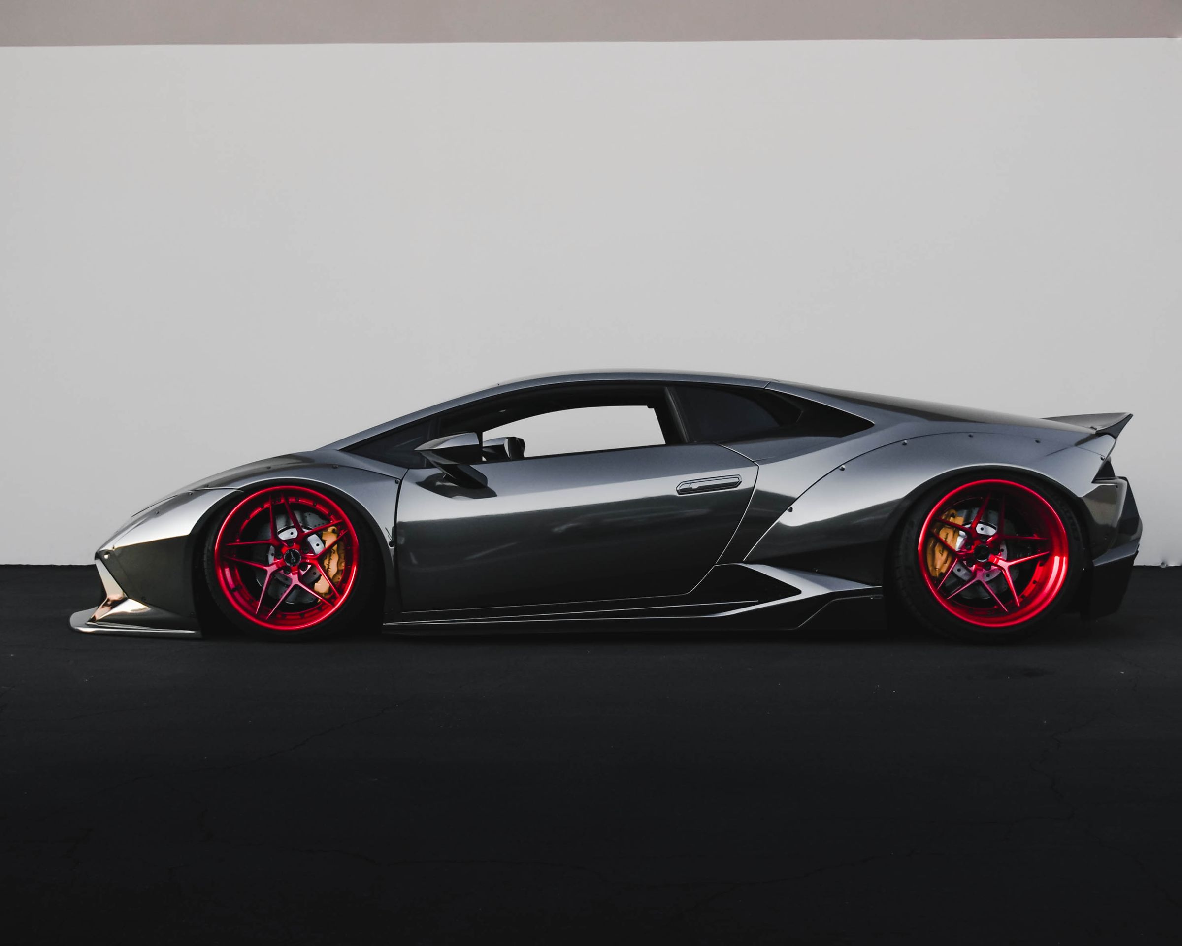 Supercar under studio lighting on black